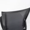 A black mesh office chair against a white background.