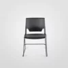 A black plastic chair against a white background.