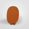 A large orange upholstered panel on a stand.