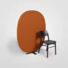 A chair next to an orange octagon shaped divider.