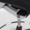 A close up of a black office chair with a metal base.