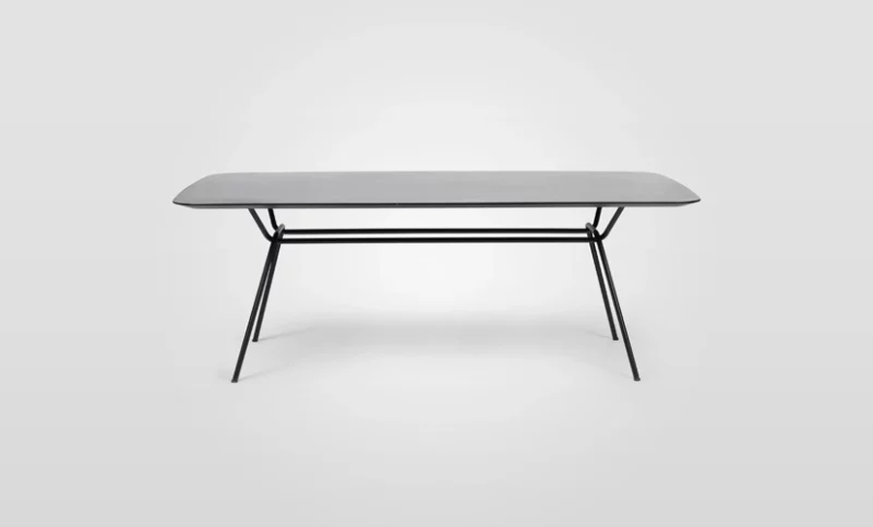 A grey table with black legs on a white background.