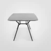 A grey table with black legs on a white background.