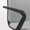 A close up of an office chair with a black armrest.