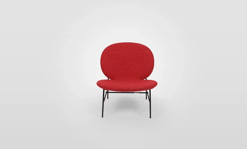 A red chair with black legs on a white background.