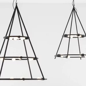 A pair of Copernico Suspension Lamps hanging from a white wall.