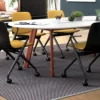 A conference room with a table and Haworth Bowi chairs.