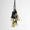 A gold and black pendant light hanging from a chain.