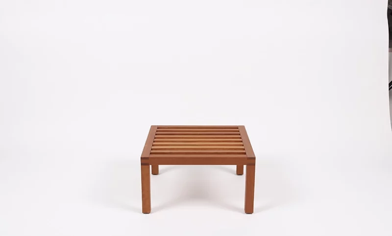 A simple wooden coffee table against a white background.