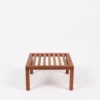 A small, wooden slatted table on a white background.