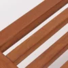 Close-up view of a wooden slatted object on a white background.