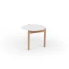 A round white tabletop with wooden legs against a white background.