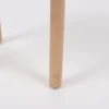 Two wooden chair legs on a white background.