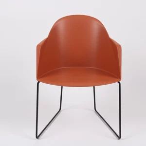 Modern orange chair with black metal legs on a white background.