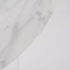 Round marble table against a white background.