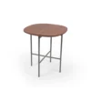 Round wooden tabletop with metal legs on a white background.