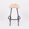 Modern stool with a curved wooden seat and black metal legs on a white background.