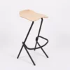 Modern chair with a black frame and a light wooden seat on a white background.