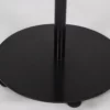 A black round table base with wheels on a white background.