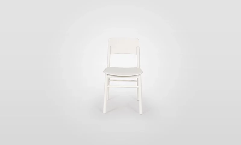 A single white chair centered against a white background.