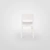 A single white folding chair centered on a plain background.