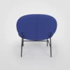 A modern blue upholstered chair with black metal legs against a white background.