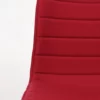 Close-up view of a red fabric chair with horizontal texture detail.