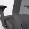 Ergonomic office chair with adjustable armrest and mesh back support.