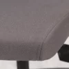 Close-up of the edge and texture of an office chair seat with stitching detail.