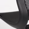 Close-up of a modern office chair with a mesh backrest and armrest.