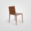 A tan leather dining chair with upholstered leather legs.